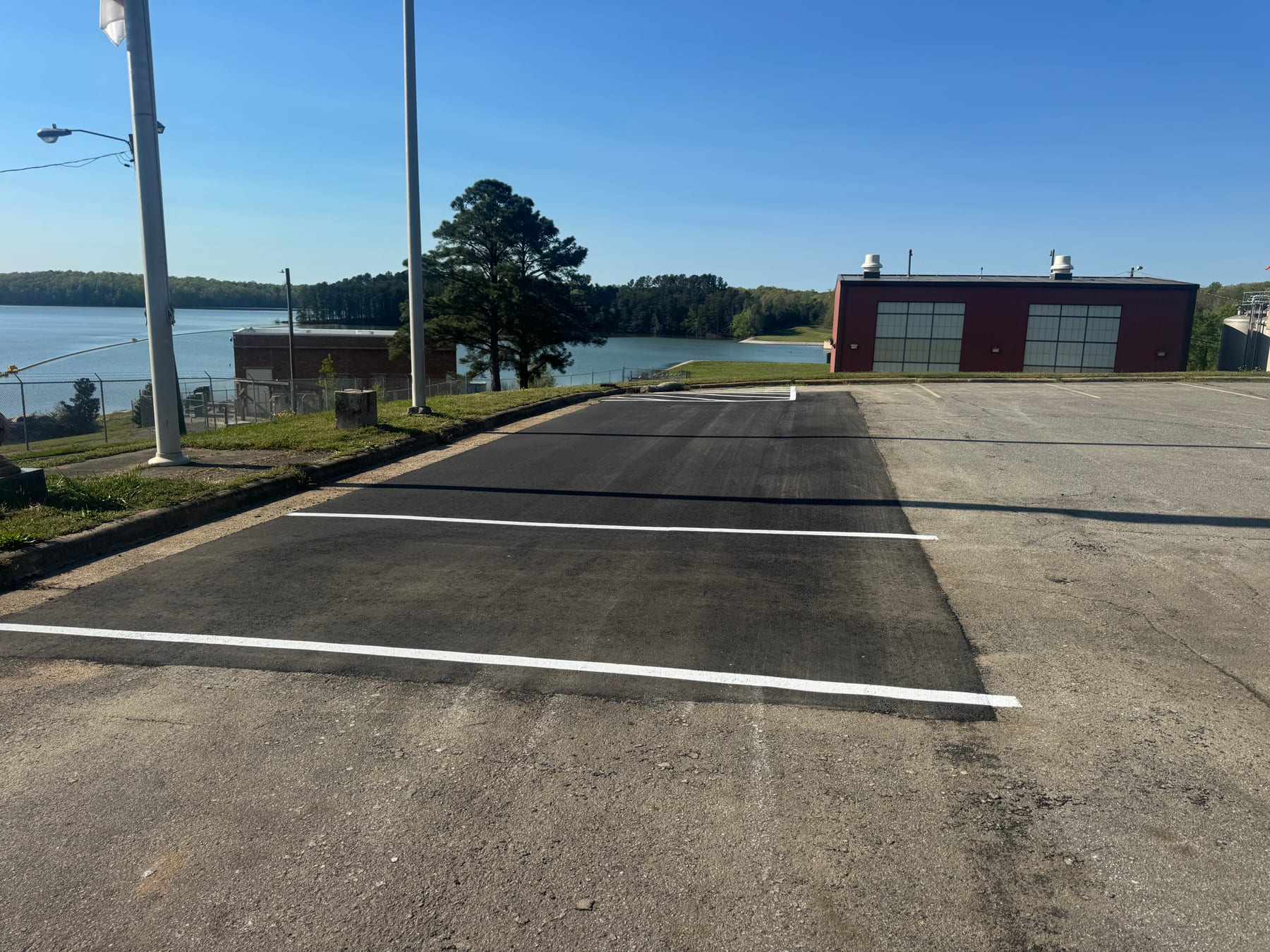 Freshly striped parking lot completed by HD Grading