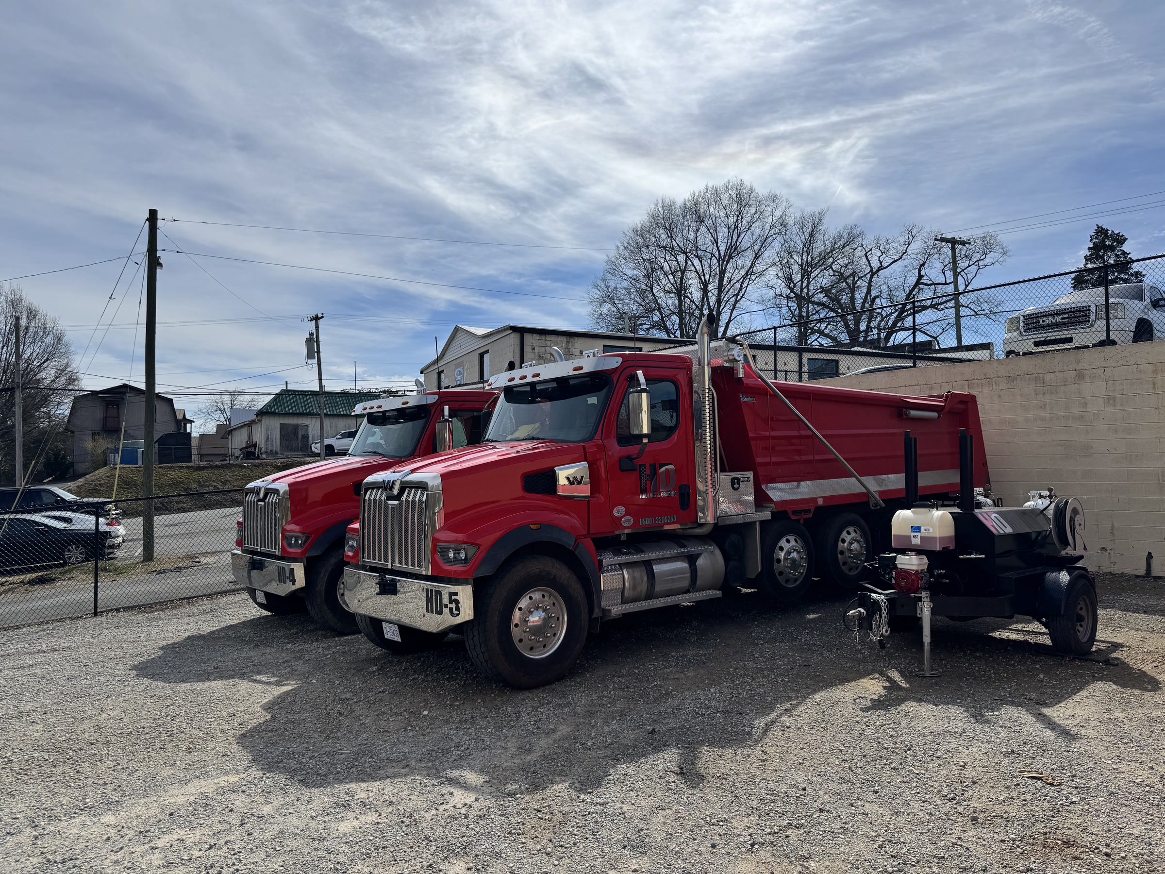 HD Grading dump truck fleet staged and ready for dispatch